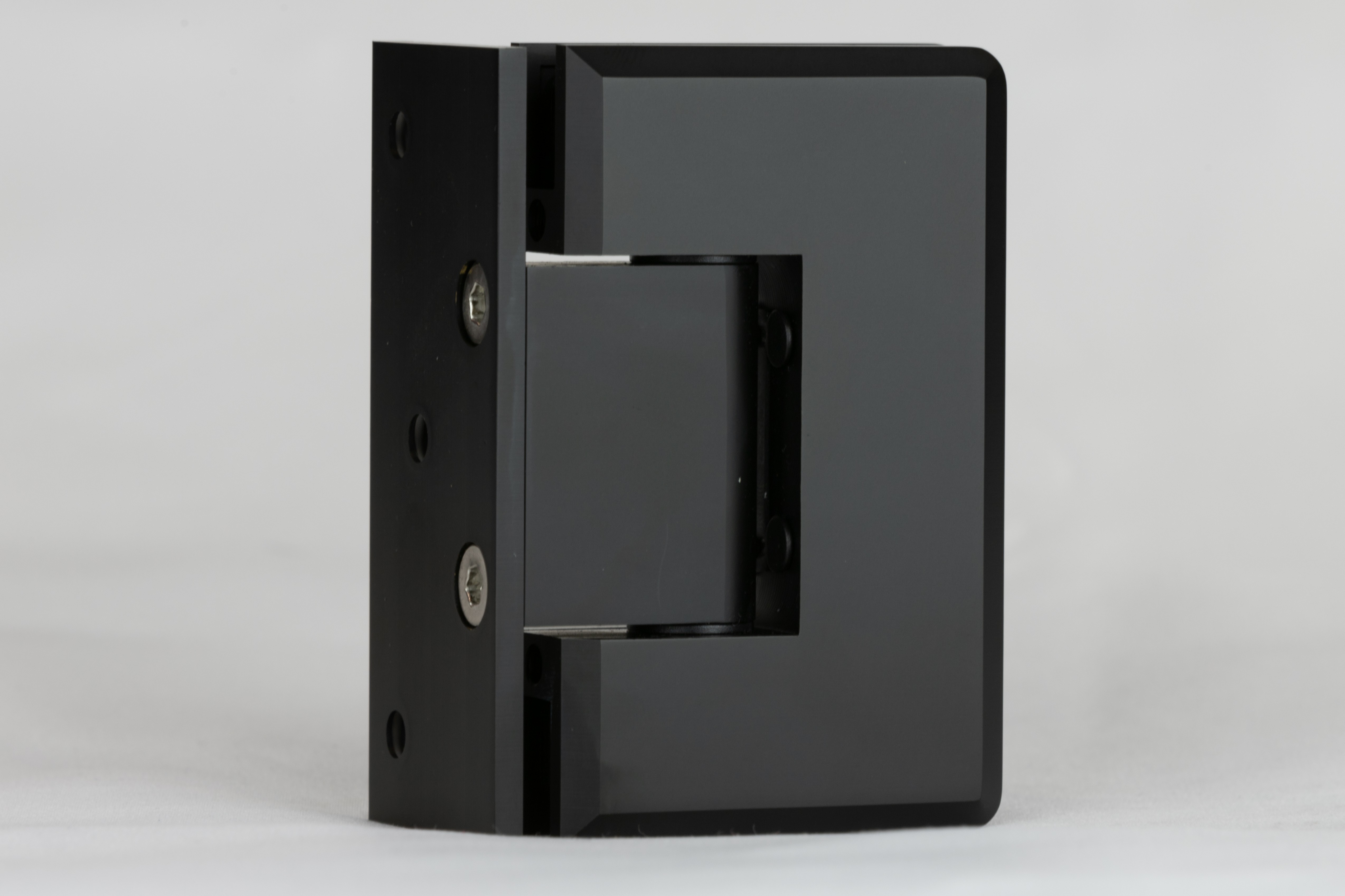 Indicative image of the product bevelled 90 degree glass to wall shower hinge in a matt black finish