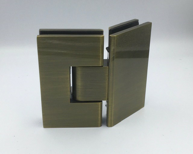 ES2.135 AB - 135 degree glass to glass shower hinge in an antique brass finish